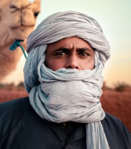 Man in White Hijab and Black Leather Jacket