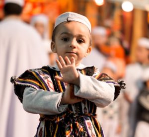 child in black and white long sleeve shirt