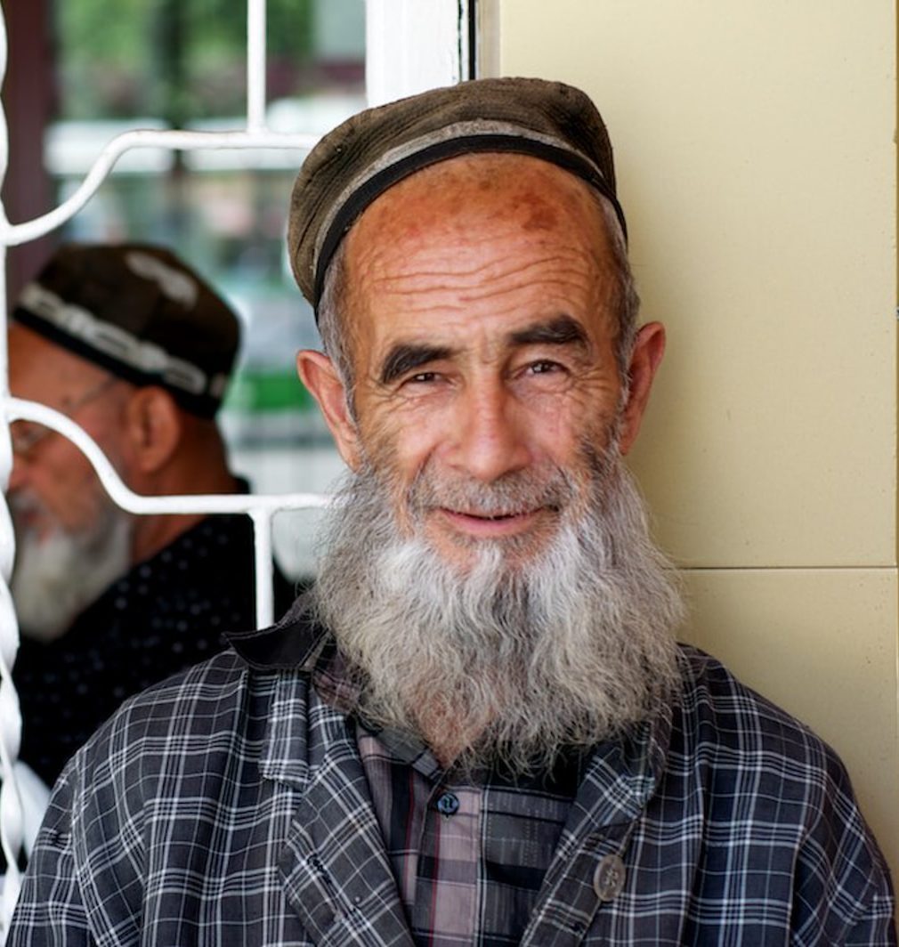 man in black and white plaid button up shirt wearing brown hat